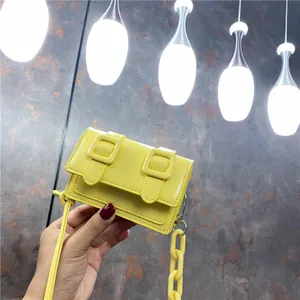Mini yellow Cambridge satchel with thick plastic chain and dopamine style crossbody strap