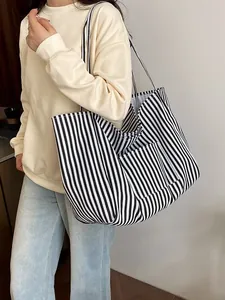 Large capacity black and white striped canvas tote bag styled as a casual shoulder bag