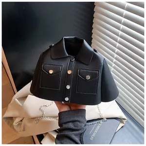 Detailed shot of creative jacket-shaped crossbody bag with silver buttons and chain
