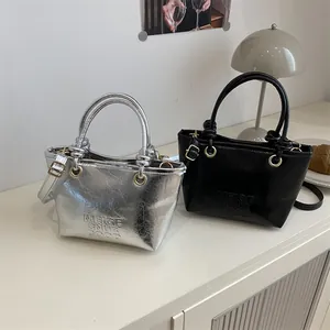 Fashionable large capacity bucket bags in silver and black with embossed lettering textures