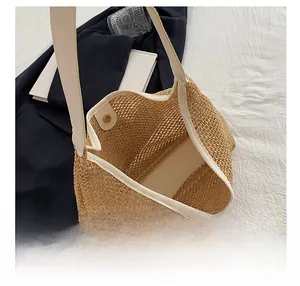Top view of woven straw tote bag showing spacious interior with metal magnetic closure