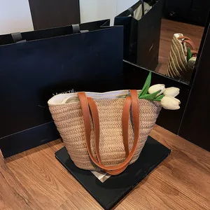 Retro woven straw tote bag with brown leather handles and large capacity for beach commute