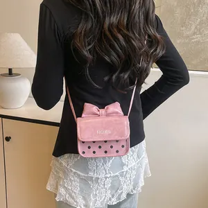 Pink vintage mini crossbody bag with bow and black polka dots for girls and women