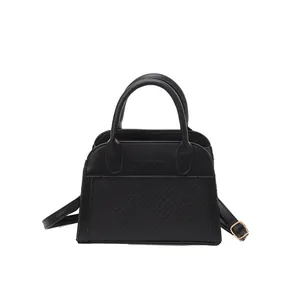 Retro black PU leather handbag with patchwork texture and adjustable shoulder strap