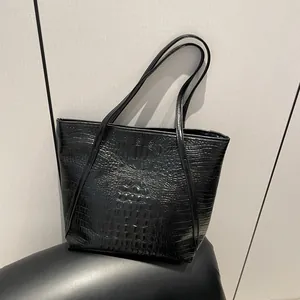 Large black crocodile embossed tote bag in high-shine faux leather with slender shoulder straps
