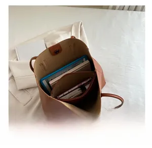 Top view showing the large internal capacity and compartments of the brown leather tote bag