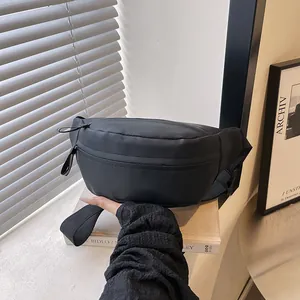 Minimalist black waterproof waist bag for women with adjustable strap for urban sports