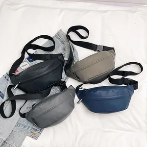 Minimalist stylish waist bags in four colors with adjustable straps on a denim background