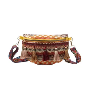 Bohemian woven waist bag with colorful fringe tassels and ethnic patterned strap