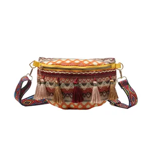 Bohemian semi-circle crossbody bag with warm-tone geometric embroidery and colorful tassels