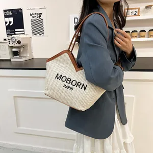 Bolso tote de paja a la moda con correas de cuero marrón y bordado Moborn Paris