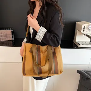 Striped canvas tote bag with adjustable shoulder strap and large capacity for women