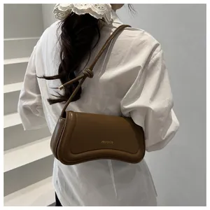 Brown PU leather shoulder bag with gold letter logo and stylish knotted strap detail
