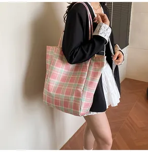 Detailed view of large capacity plaid tote bag with pink and green Scottish pattern