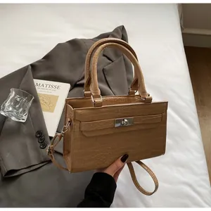 Khaki crocodile pattern square handbag with silver metal twist lock and top handles
