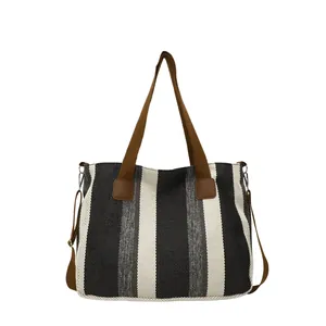 Large striped canvas tote bag with brown straps and crossbody belt for women