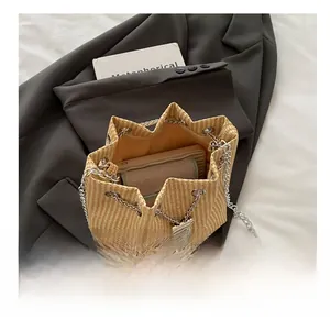 Detail view of the drawstring bucket bag showing its spacious interior capacity and strap
