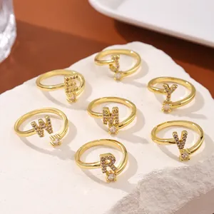 Luxury gold adjustable initial rings set with sparkling cubic zirconia letters and diamonds
