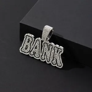 Close-up of iced out BANK letter pendant with silver plating and sparkling crystals