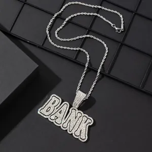 Detailed macro view of silver BANK letter pendant with sparkling cubic zirconia on rope chain