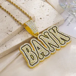 Close-up of golden BANK letter pendant with iced-out crystals and a twist chain