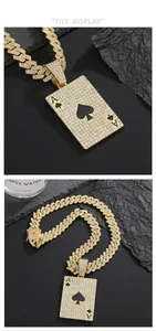 Macro shot of gold hip hop Cuban chain with iced out Ace of Spades poker card pendant