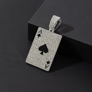 Macro shot of silver Ace of Spades poker pendant with white sparkling rhinestones
