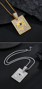 Détail de pendentifs Œil d'Horus hip hop en or et argent avec des pierres de zircon