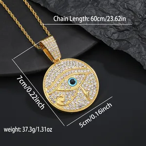 Macro detail of gold Eye of Horus pendant necklace with crystals on a twisted rope chain
