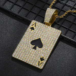 Macro shot of hip hop Ace of Spades pendant with iced-out rhinestones and gold twist chain