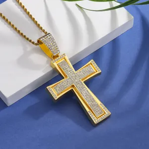 Close-up of hip hop gold cross pendant with iced out crystals and rope chain link