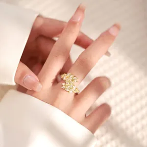Macro detail of 18K gold plated ring featuring sparkling marquise-cut zircon clusters