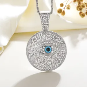 Detail of Eye of Horus pendant necklace with sparkling rhinestones and rope chain on silk