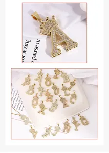 Macro detail of gold crown alphabet pendant with sparkling micro-pave cubic zirconia