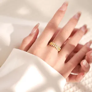 Close-up of 18K gold plated zircon geometric ring with double row crisscross leaf design