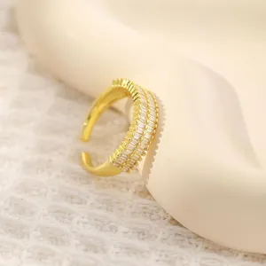 Macro detail of 18K gold plated ring featuring double-row baguette cubic zirconia