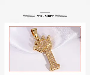 Detail of gold crown letter I pendant with white zircon micro-inlays on silk