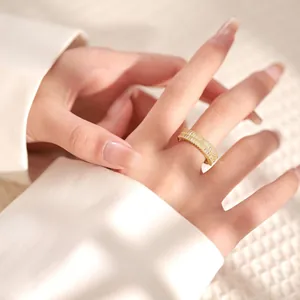 Detail of 18K gold plated ring featuring double rows of baguette-cut cubic zirconia