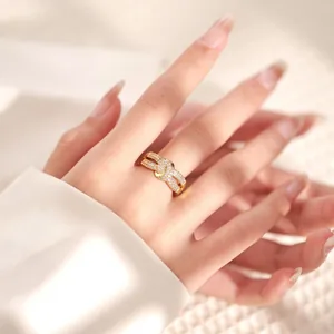 Close-up of 18K gold-plated double-layer knot ring with micro-set shimmering cubic zirconia