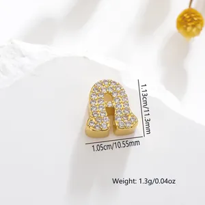 Detailed view of gold letter A pendant with cubic zirconia inlay and size dimensions
