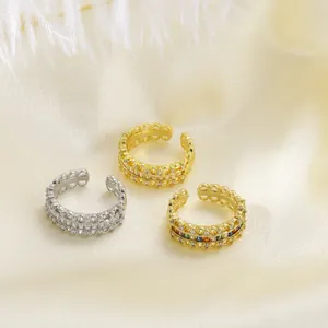 Detailed view of adjustable open rings with colorful zircon inlay and wavy hollow edges