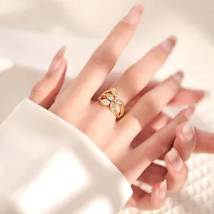 Close-up of 18K gold plated ring with marquise zircon stones on woman hand