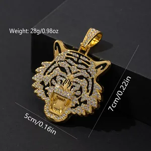 Macro shot of tiger head pendant with white crystals and black enamel stripes