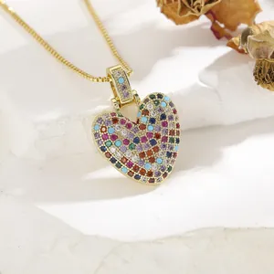 Close-up of heart pendant with multi-colored cubic zirconia and gold-plated chain