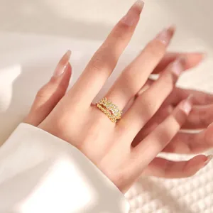 Detail of 18K gold plated zircon rings with beaded design and shimmering crystals