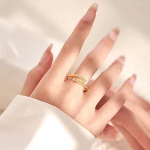 Detailed view of model wearing a double-layer 18K gold plated ring with zircon stones
