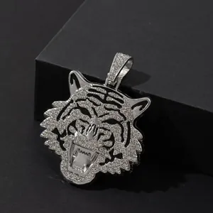 Silver cuban hip hop necklace with iced out tiger head pendant on black background
