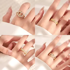 Four 18K gold plated zircon rings in French luxury style on white silk background