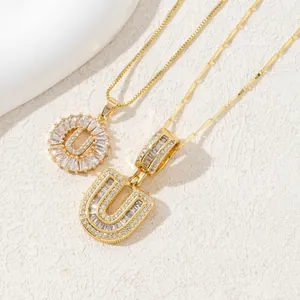 Gold-plated 'U' letter necklace featuring zircon-encrusted round halo and cubic stones