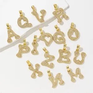 Gold plated copper heart initial pendants with sparkling white cubic zirconia stones